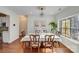 Bright dining area with hardwood floors, chandelier, and stained glass window at 2003 Galty Ln, Charlotte, NC 28270