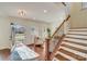 Bright and airy entryway with hardwood floors and staircase at 2003 Galty Ln, Charlotte, NC 28270