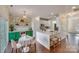 Open kitchen boasts modern white cabinets, marble island, and stylish green accents at 2003 Galty Ln, Charlotte, NC 28270