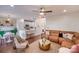 Spacious living room showcases a brown leather sectional sofa and a gold coffee table at 2003 Galty Ln, Charlotte, NC 28270