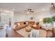 Relaxing living room with a brown leather sectional sofa and a cozy fireplace at 2003 Galty Ln, Charlotte, NC 28270