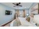 Main bedroom with king bed, hardwood floors, and TV at 2003 Galty Ln, Charlotte, NC 28270