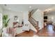 View of staircase and living area with a wooden railing and comfortable seating at 2003 Galty Ln, Charlotte, NC 28270