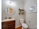 Clean bathroom with updated vanity and floating shelves at 2033 Roscommon Dr, Clover, SC 29710