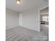 Well-lit bedroom with neutral decor and carpet flooring at 2033 Roscommon Dr, Clover, SC 29710