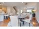 Open concept dining room with hardwood floors, adjacent to kitchen and living room at 2033 Roscommon Dr, Clover, SC 29710