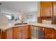 Kitchen island with sink, dishwasher, and granite countertop at 2033 Roscommon Dr, Clover, SC 29710