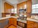 Modern kitchen with stainless steel appliances and wood cabinets at 2033 Roscommon Dr, Clover, SC 29710