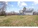 Large backyard with grassy area and deck at 212 King George Ln, Gastonia, NC 28056