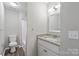 Simple bathroom with granite vanity and tub/shower at 212 King George Ln, Gastonia, NC 28056