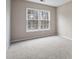 Bright bedroom with large window and neutral carpeting at 212 King George Ln, Gastonia, NC 28056