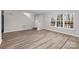 Open living room with wood-look floors and staircase at 212 King George Ln, Gastonia, NC 28056