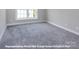 Bright bedroom featuring carpeted floor and window at 266 Gilead Rd, Huntersville, NC 28078