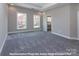 Spacious bedroom with carpet and large window at 266 Gilead Rd, Huntersville, NC 28078