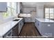 Modern kitchen with gray cabinets, white quartz countertops, and island at 266 Gilead Rd, Huntersville, NC 28078