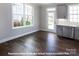 Modern kitchen with gray cabinets, white quartz countertops, and island at 266 Gilead Rd, Huntersville, NC 28078