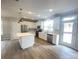 Bright kitchen with stainless steel appliances and a center island overlooking a dining area at 266 Gilead Rd, Huntersville, NC 28078