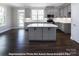 Modern kitchen with gray cabinets, quartz countertops, and island at 266 Gilead Rd, Huntersville, NC 28078