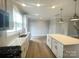 Bright kitchen featuring quartz countertops, stainless appliances, and an open floor plan at 266 Gilead Rd, Huntersville, NC 28078