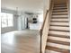Spacious living room with hardwood floors, a modern chandelier and kitchen view at 266 Gilead Rd, Huntersville, NC 28078