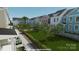 Street rendering of colorful new construction townhomes with sidewalks and green space at 266 Gilead Rd, Huntersville, NC 28078