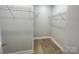 Walk-in closet with wire shelving and hardwood floors at 266 Gilead Rd, Huntersville, NC 28078