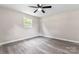 Simple bedroom with ceiling fan and light grey flooring at 2697 Knotty Pine Dr, Lancaster, SC 29720