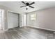 Spacious bedroom featuring a large closet and wood-look floors at 2697 Knotty Pine Dr, Lancaster, SC 29720