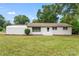 Charming ranch home features a white brick exterior and lush lawn at 2697 Knotty Pine Dr, Lancaster, SC 29720