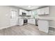 Updated kitchen with white cabinets and granite countertops at 2697 Knotty Pine Dr, Lancaster, SC 29720