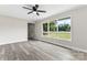 Bright living room with hardwood floors and large windows at 2697 Knotty Pine Dr, Lancaster, SC 29720