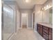 Modern bathroom featuring a large shower, granite vanity, and walk-in closet at 2836 Santiago Cir, Monroe, NC 28110