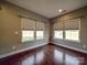 Bright dining room with hardwood floors and large windows offering natural light at 2836 Santiago Cir, Monroe, NC 28110