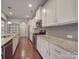 Modern kitchen with granite countertops and stainless steel appliances at 2836 Santiago Cir, Monroe, NC 28110