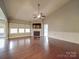 Spacious living room with hardwood floors, fireplace, and high ceilings at 2836 Santiago Cir, Monroe, NC 28110