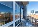 Private balcony with table and chairs, city view at 300 Magnolia Ave # 301, Charlotte, NC 28203