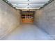 Private garage with storage shelving at 300 Magnolia Ave # 301, Charlotte, NC 28203