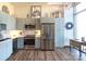 Modern kitchen with stainless steel appliances and light blue cabinetry at 300 Magnolia Ave # 301, Charlotte, NC 28203