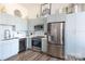 Modern kitchen with stainless steel appliances and light blue cabinets at 300 Magnolia Ave # 301, Charlotte, NC 28203