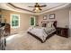 Bright bedroom with carpeted floors, ceiling fan, and ample closet space at 3196 Stonemill Path, Sherrills Ford, NC 28673