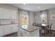 Kitchen island with granite countertops and view of backyard at 3917 Coleman Dr, Charlotte, NC 28215