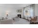 Cozy living room with a corner fireplace and hardwood floors at 3917 Coleman Dr, Charlotte, NC 28215