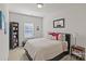 Bright bedroom with a queen bed and bookcase at 4020 Harmony Hills Dr, Matthews, NC 28104