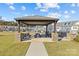 Community picnic area with grills under covered pavilion at 4020 Harmony Hills Dr, Matthews, NC 28104