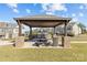 Outdoor community space with grills and picnic tables at 4020 Harmony Hills Dr, Matthews, NC 28104