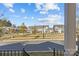 View of a townhome community with green space and walking paths at 4020 Harmony Hills Dr, Matthews, NC 28104