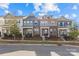 Row of townhouses showcasing different exterior colors and styles at 4020 Harmony Hills Dr, Matthews, NC 28104