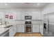 Bright kitchen featuring double oven and white cabinetry at 4020 Harmony Hills Dr, Matthews, NC 28104