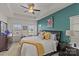 Spacious main bedroom with ceiling fan and accent wall at 4020 Harmony Hills Dr, Matthews, NC 28104