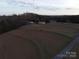 Aerial view of land with small building and surrounding trees at 4126 Oxford School Rd, Catawba, NC 28609